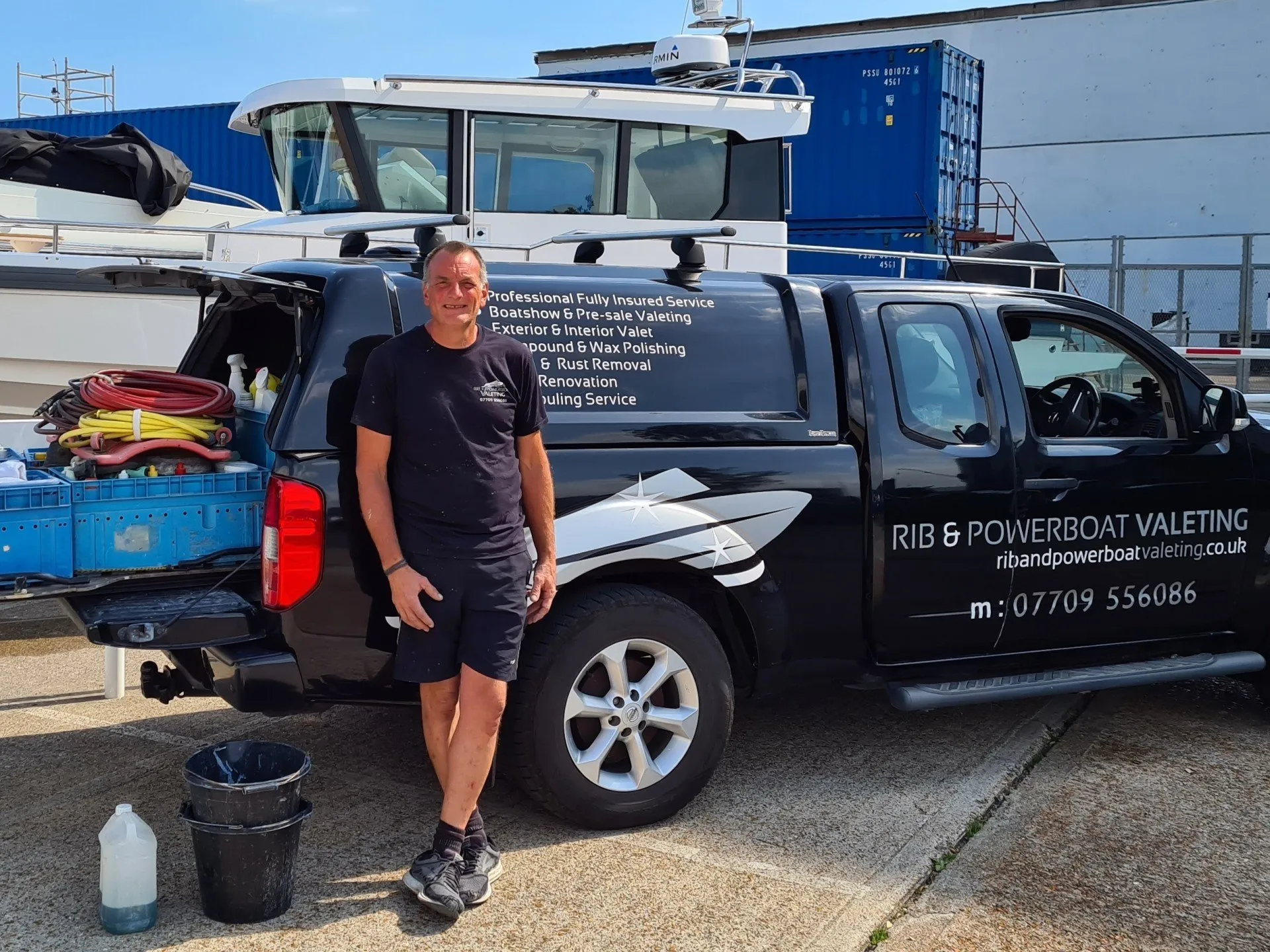 Simon owner of rib and powerboat valeting next to his truck